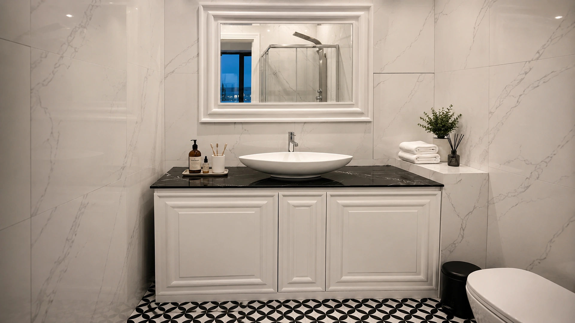 Classic white vanity with a black stone countertop, countertop basin and large mirror.