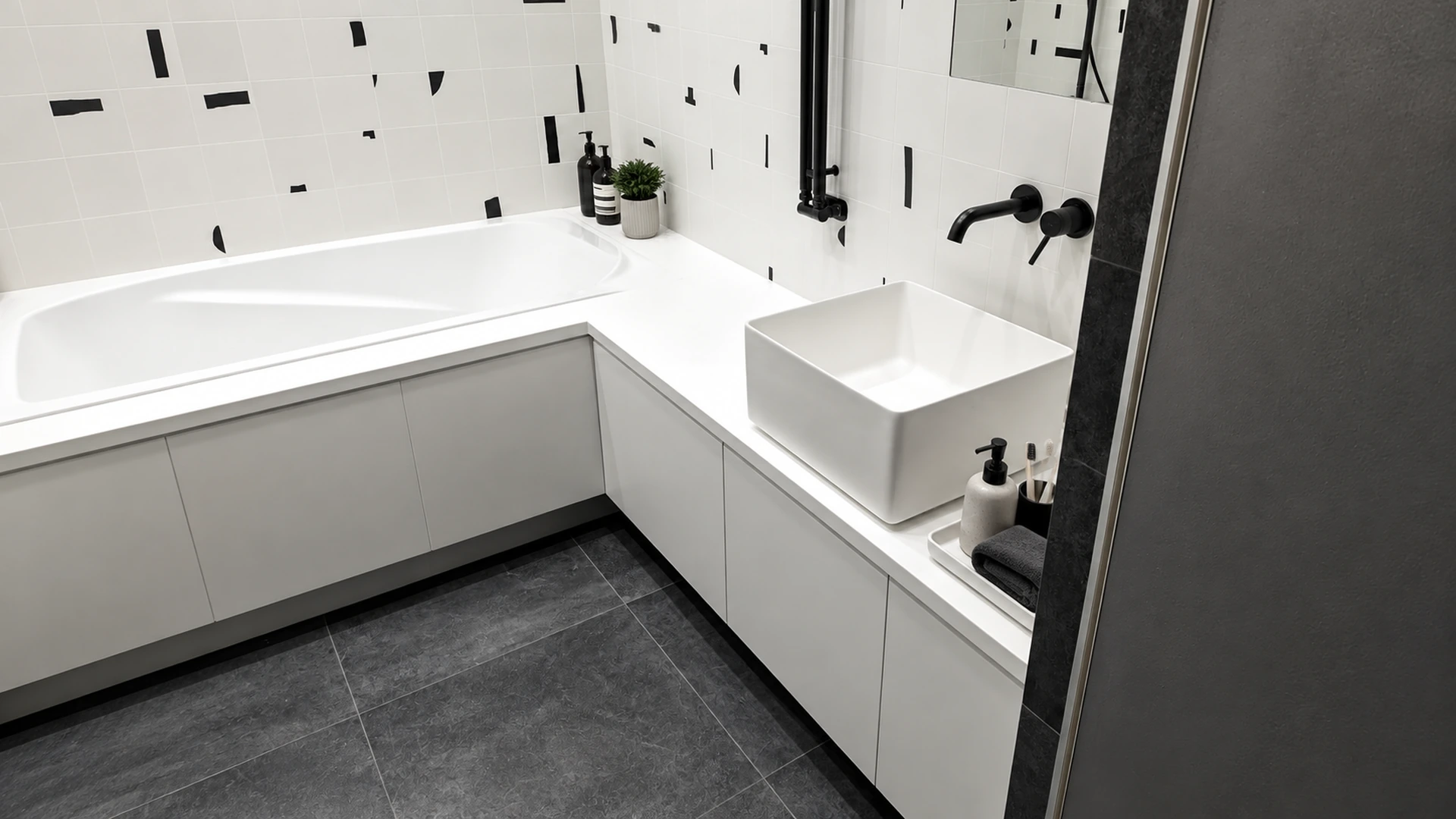 Black and white bathroom with a corner bath, square basin and wall-mounted cabinets.